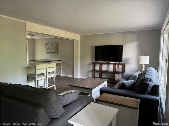 9689 Pine Ln, Evart, MI 49631 - living area featuring wood finished floors and crown molding