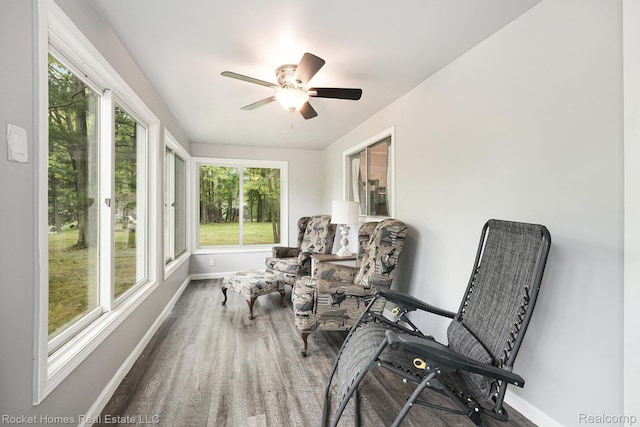 9689 Pine Ln, Evart, MI 49631 - sunroom featuring baseboards and wood finished floors