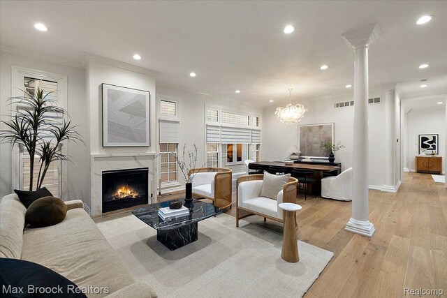 855 Wallace St, Birmingham, MI 48009 - living area featuring ornamental molding, recessed lighting, a premium fireplace, light wood-type flooring, and ornate columns