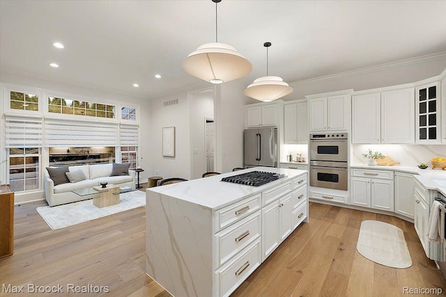 855 Wallace St, Birmingham, MI 48009 - kitchen featuring appliances with stainless steel finishes, crown molding, recessed lighting, light wood-type flooring, and glass insert cabinets