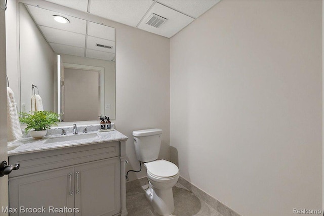 855 Wallace St, Birmingham, MI 48009 - bathroom featuring toilet, a paneled ceiling, vanity, and baseboards