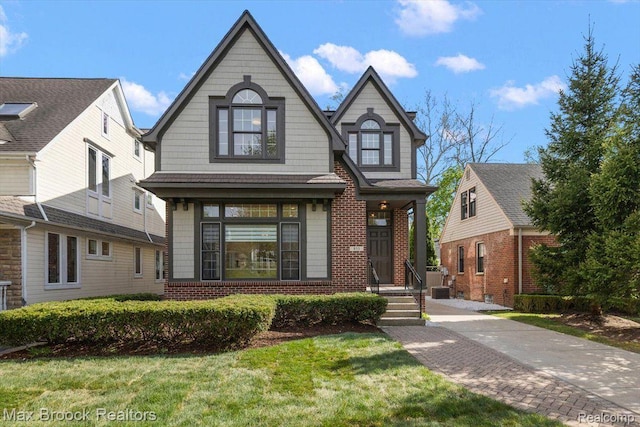 855 Wallace St, Birmingham, MI 48009 - view of front of home with brick siding and a front yard