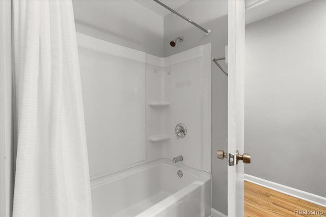 26080 Elba, Redford, MI 48239 - bathroom with shower / tub combo, baseboards, and wood finished floors