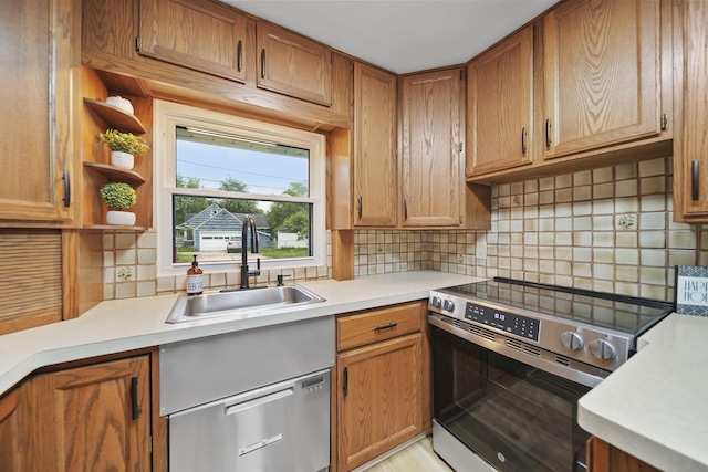 801 Briarcliff Rd, Jackson, MI 49203 - kitchen with stainless steel range with electric stovetop, a sink, light countertops, and tasteful backsplash