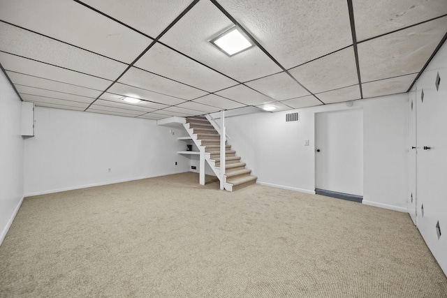801 Briarcliff Rd, Jackson, MI 49203 - finished basement with stairs, carpet, a drop ceiling, and baseboards