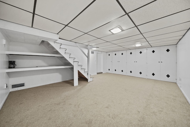 801 Briarcliff Rd, Jackson, MI 49203 - finished basement featuring carpet floors, a drop ceiling, stairs, and baseboards