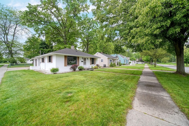 801 Briarcliff Rd, Jackson, MI 49203 - ranch-style home featuring a chimney and a front yard