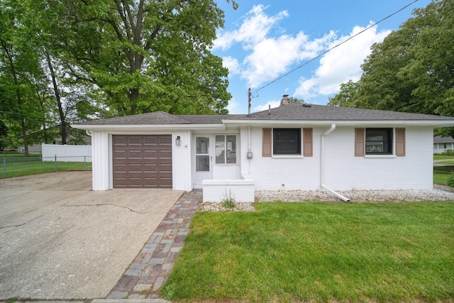 801 Briarcliff Rd, Jackson, MI 49203 - view of front of home featuring driveway, an attached garage, a chimney, brick siding, and a shingled roof