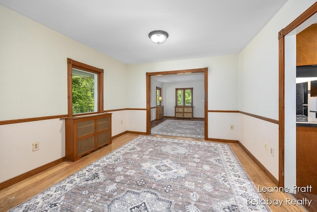 13814 28th St, Lowell, MI 49331 - empty room featuring wood finished floors and baseboards