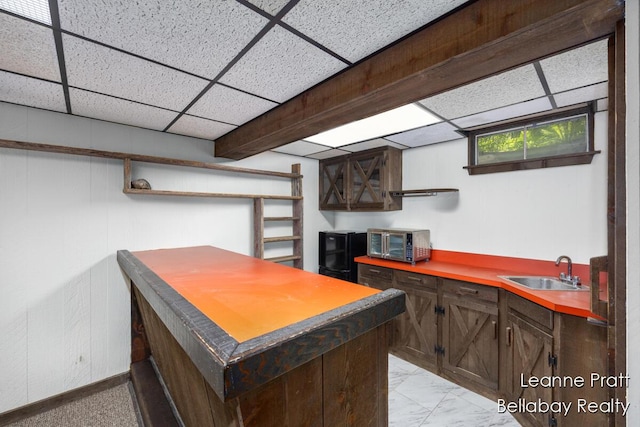 13814 28th St, Lowell, MI 49331 - kitchen with open shelves, a sink, a drop ceiling, and dark brown cabinets