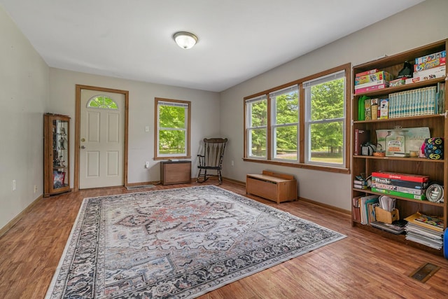 9303 W H Ave, Kalamazoo, MI 49009 - sitting room with wood finished floors and baseboards
