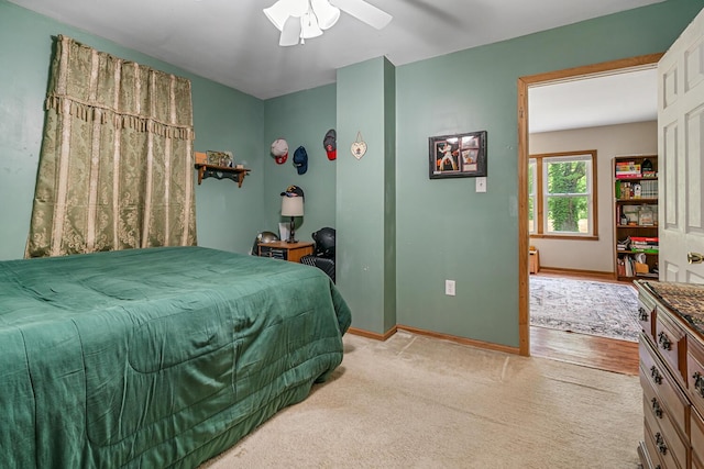 9303 W H Ave, Kalamazoo, MI 49009 - bedroom featuring light colored carpet, baseboards, and a ceiling fan