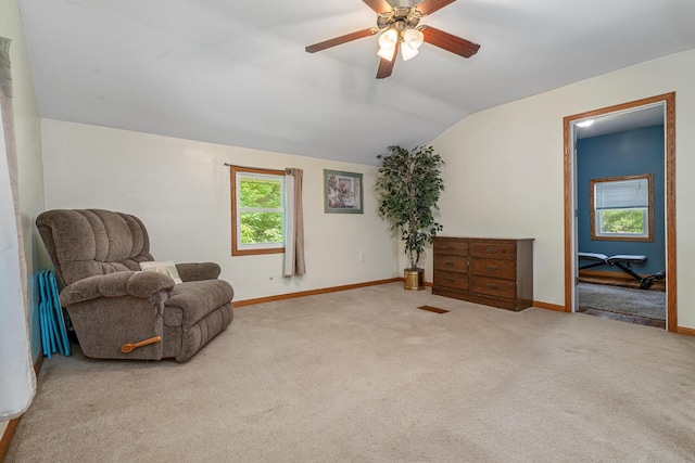 9303 W H Ave, Kalamazoo, MI 49009 - sitting room with lofted ceiling, carpet flooring, a ceiling fan, and baseboards