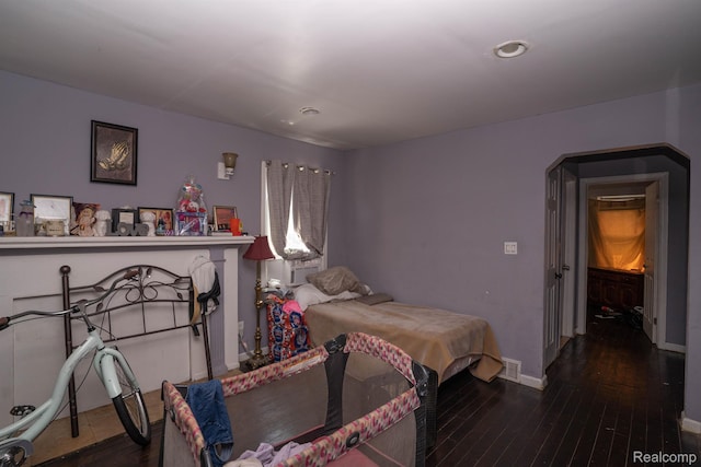 18459 Hubbell St, Detroit, MI 48235 - bedroom with hardwood / wood-style flooring, baseboards, recessed lighting, and arched walkways
