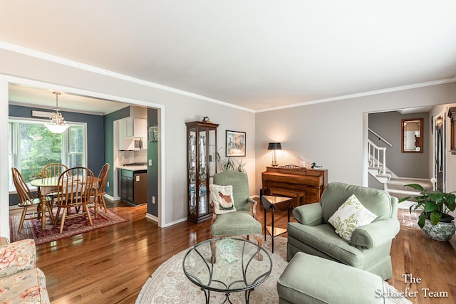 493 Edgeworthe Dr SE, Ada, MI 49301 - living area featuring wood finished floors, stairway, crown molding, and baseboards