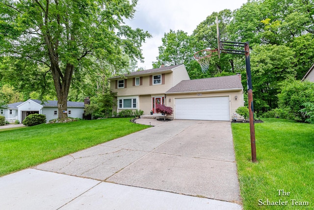 493 Edgeworthe Dr SE, Ada, MI 49301 - colonial home featuring an attached garage, a front lawn, and driveway