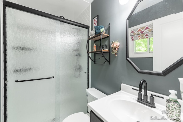 493 Edgeworthe Dr SE, Ada, MI 49301 - bathroom featuring a stall shower, toilet, and vanity