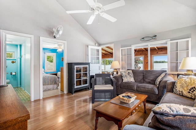 263 Waffle Dr, Coldwater, MI 49036 - living area featuring wood finished floors, high vaulted ceiling, a ceiling fan, and a water view