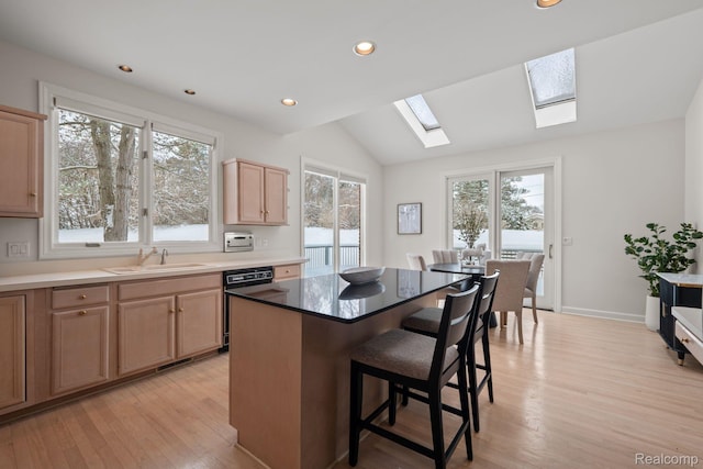 2729 Glenbrooke Ct, Bloomfield Hills, MI 48302 - kitchen with a sink, dishwasher, a skylight, light wood-type flooring, and light brown cabinets