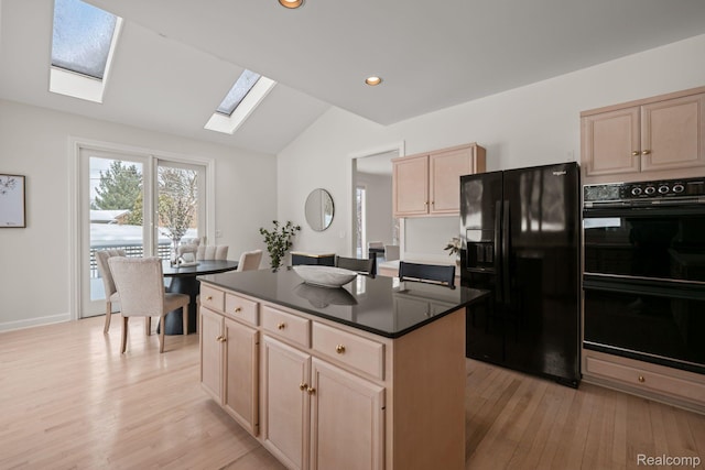 2729 Glenbrooke Ct, Bloomfield Hills, MI 48302 - kitchen featuring black appliances, a skylight, vaulted ceiling, light brown cabinetry, and light wood-style flooring