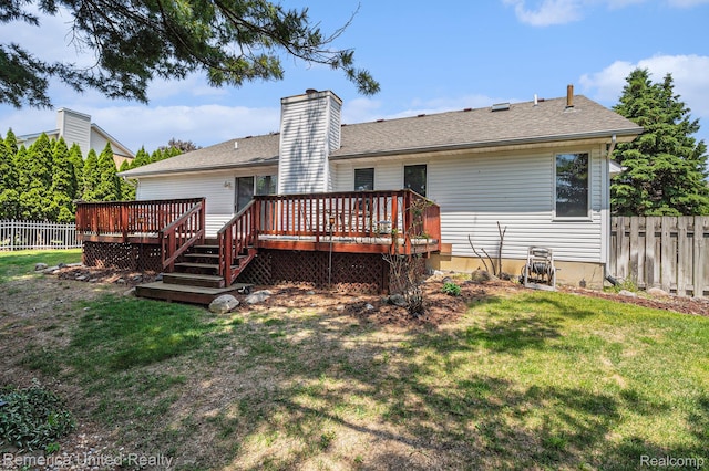 2458 Oseola Ave, Howell, MI 48843 - rear view of property with a deck, a chimney, and a shingled roof