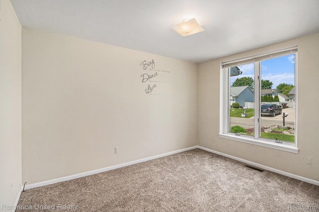 2458 Oseola Ave, Howell, MI 48843 - spare room with carpet flooring and baseboards