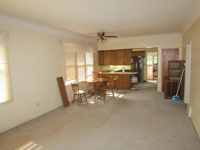205 Pine St, Corunna, MI 48817 - dining room with ceiling fan and light carpet