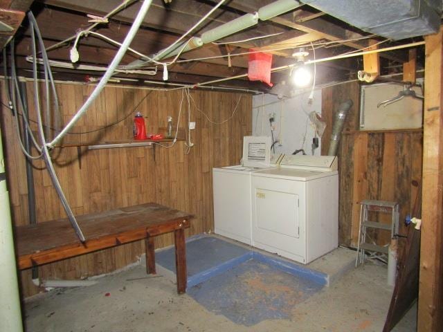 205 Pine St, Corunna, MI 48817 - unfinished below grade area featuring washer and dryer and wood walls