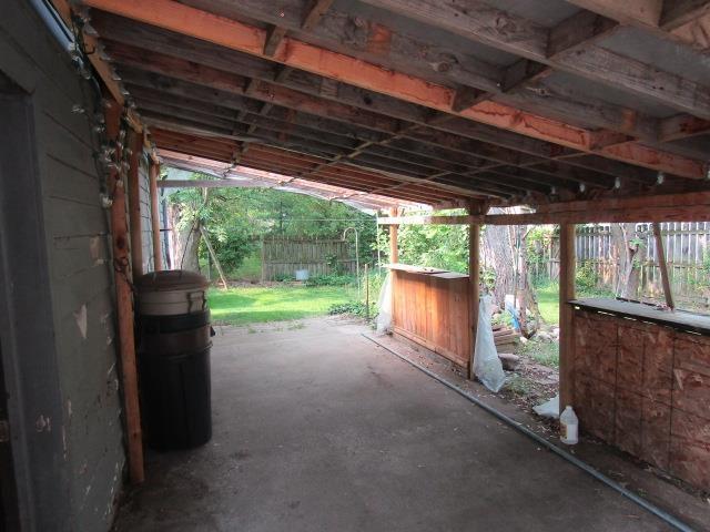 205 Pine St, Corunna, MI 48817 - fenced backyard with a patio