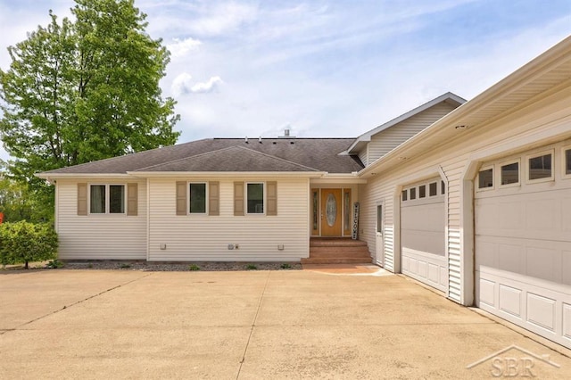 681 Quillett Dr, Beaverton, MI 48612 - ranch-style house with driveway, roof with shingles, and a garage