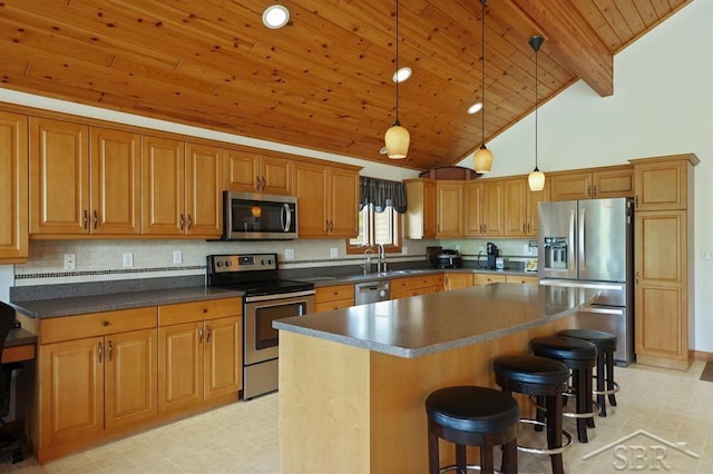 681 Quillett Dr, Beaverton, MI 48612 - kitchen with appliances with stainless steel finishes, wooden ceiling with exposed beams, light floors, a kitchen island, and a sink