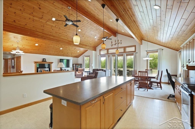 681 Quillett Dr, Beaverton, MI 48612 - kitchen with a ceiling fan, wooden ceiling, a center island, stainless steel electric stove, and baseboards