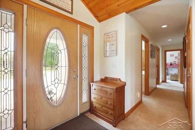 681 Quillett Dr, Beaverton, MI 48612 - foyer entrance featuring light colored carpet, baseboards, recessed lighting, and lofted ceiling