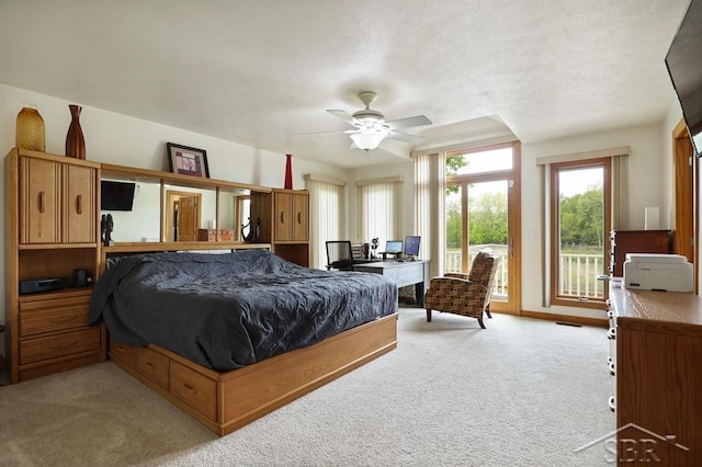 681 Quillett Dr, Beaverton, MI 48612 - bedroom with access to exterior, light carpet, a desk, and baseboards