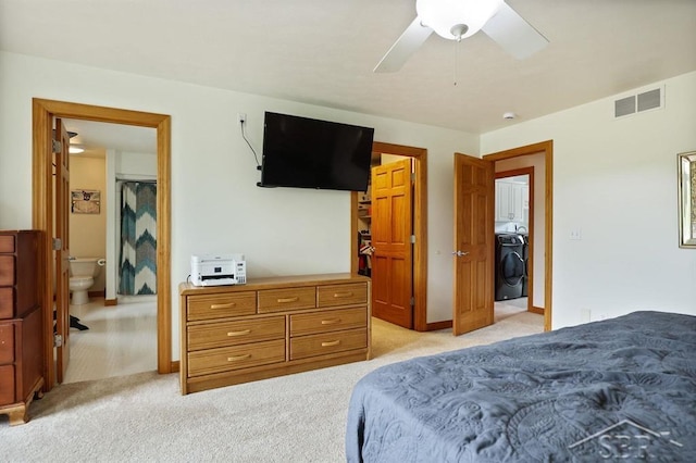 681 Quillett Dr, Beaverton, MI 48612 - bedroom with washer / clothes dryer, light carpet, and a ceiling fan