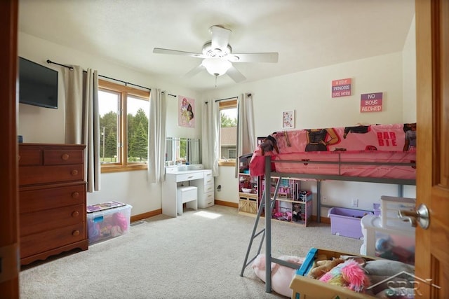 681 Quillett Dr, Beaverton, MI 48612 - bedroom featuring carpet floors, baseboards, and ceiling fan