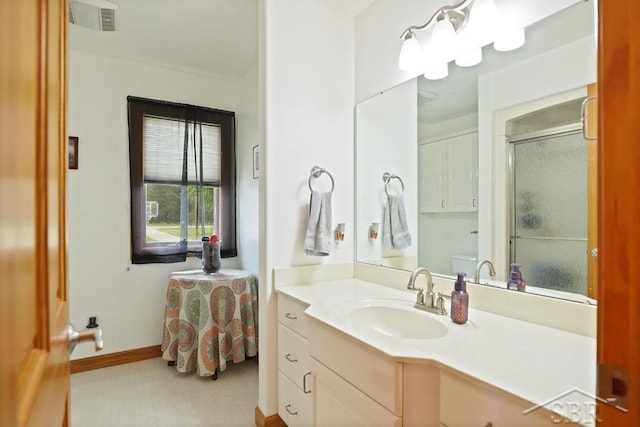 681 Quillett Dr, Beaverton, MI 48612 - full bath featuring a shower with door, vanity, and baseboards