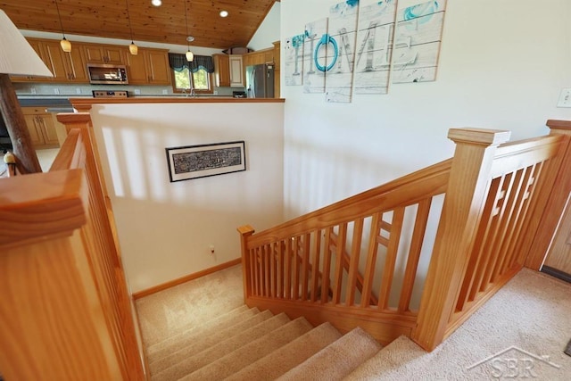681 Quillett Dr, Beaverton, MI 48612 - stairs with carpet floors, wooden ceiling, baseboards, vaulted ceiling, and recessed lighting