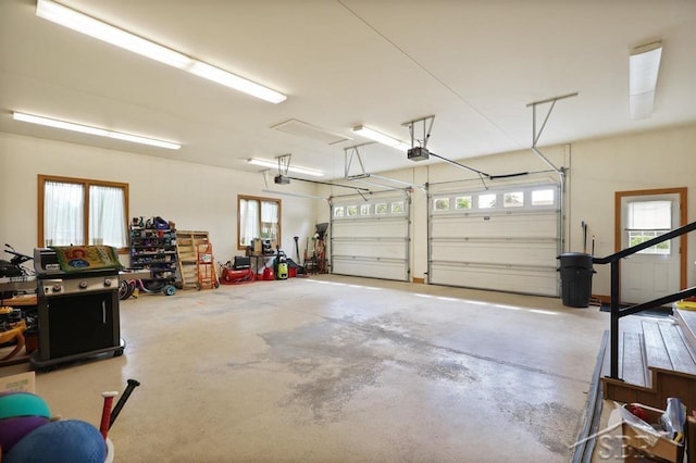 681 Quillett Dr, Beaverton, MI 48612 - garage featuring a garage door opener