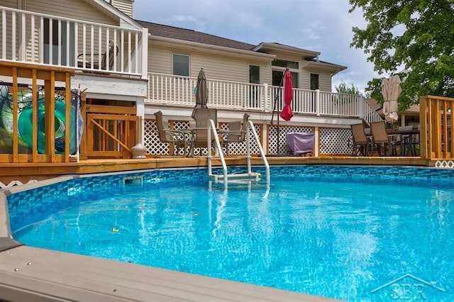 681 Quillett Dr, Beaverton, MI 48612 - swimming pool with a deck