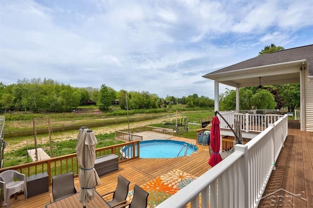 681 Quillett Dr, Beaverton, MI 48612 - view of swimming pool featuring a wooden deck