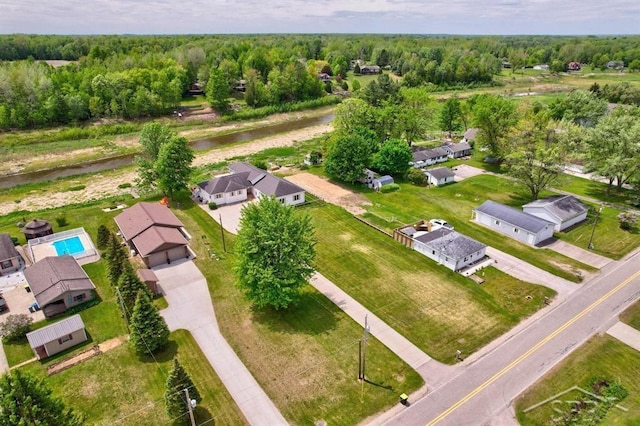 681 Quillett Dr, Beaverton, MI 48612 - aerial overview of property's location featuring a heavily wooded area and nearby suburban area