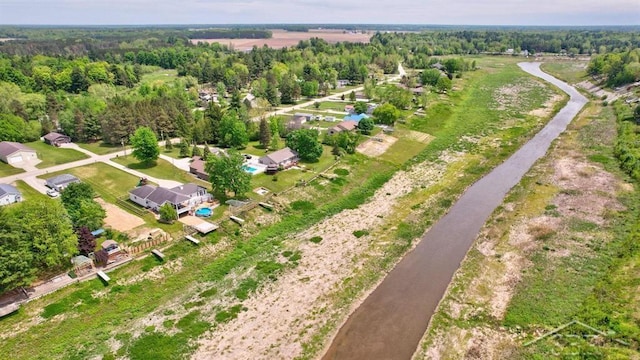 681 Quillett Dr, Beaverton, MI 48612 - aerial view of property and surrounding area with a forest