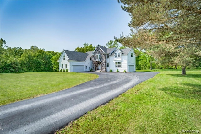 10726 Davisburg Rd, Davisburg, MI 48350 - traditional-style home featuring driveway, a front lawn, and a garage