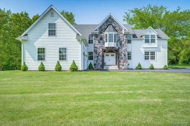 10726 Davisburg Rd, Davisburg, MI 48350 - view of front of house featuring a front yard, stone siding, and roof with shingles