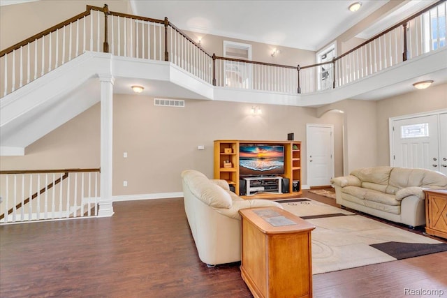 10726 Davisburg Rd, Davisburg, MI 48350 - living room featuring dark wood-style flooring, a high ceiling, and baseboards