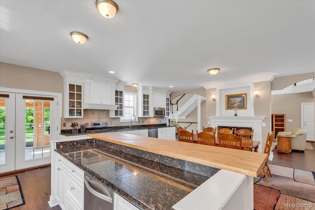 10726 Davisburg Rd, Davisburg, MI 48350 - kitchen with appliances with stainless steel finishes, healthy amount of natural light, dark wood-type flooring, white cabinetry, and recessed lighting