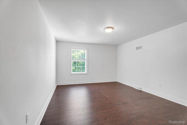 10726 Davisburg Rd, Davisburg, MI 48350 - spare room with dark wood finished floors and baseboards