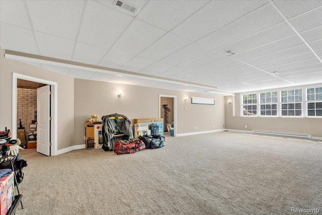 10726 Davisburg Rd, Davisburg, MI 48350 - below grade area with baseboard heating, carpet floors, baseboards, and a paneled ceiling