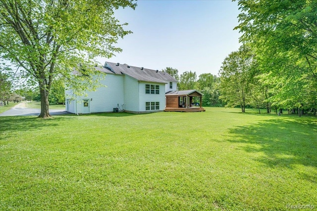 10726 Davisburg Rd, Davisburg, MI 48350 - view of grassy yard featuring a deck